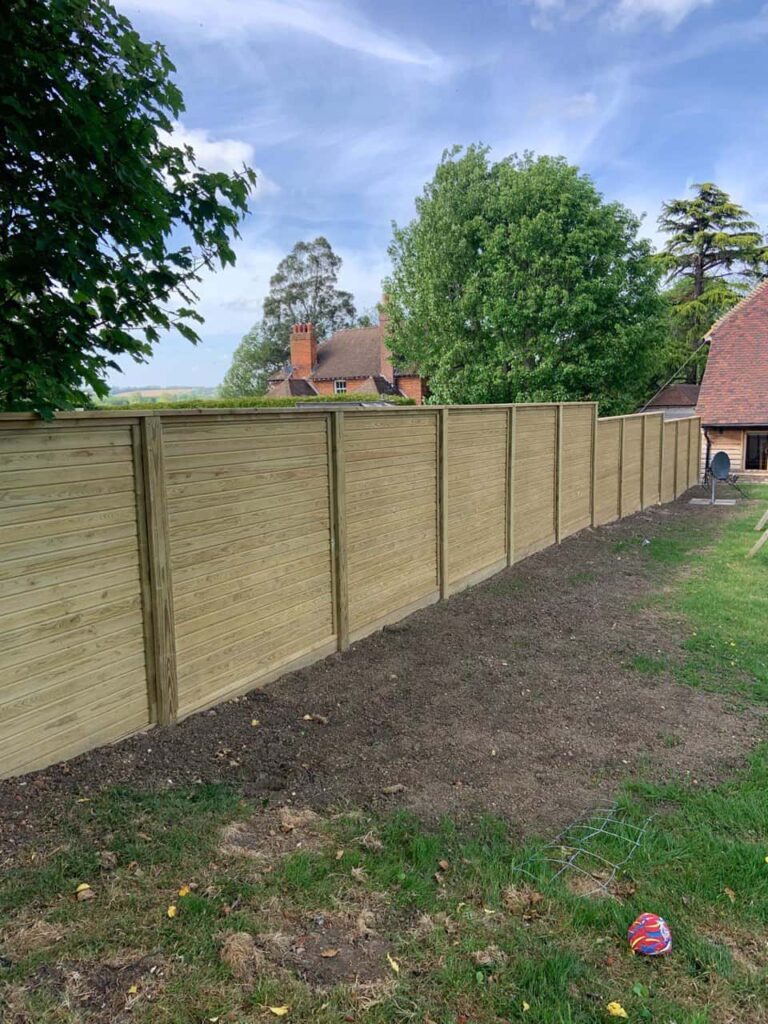 This is a photo of an acoustic fence installed by Fast Fix Fencing Kings Lynn